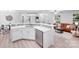 Open kitchen with quartz countertops, stainless steel appliances, and views into the living room at 5564 N Hillsdale Dr, Fort Lawn, SC 29714