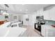 Bright kitchen featuring stainless steel appliances, light wood floors, and a breakfast bar at 5564 N Hillsdale Dr, Fort Lawn, SC 29714