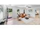 Bright living room featuring a stylish leather sofa, modern decor, and ample natural light at 5564 N Hillsdale Dr, Fort Lawn, SC 29714