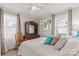 Cozy bedroom featuring a queen bed, natural light, and minimalist decor at 592 Shoreline Rd, New London, NC 28127
