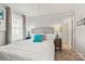 Bedroom featuring a queen bed, plush carpet, window with curtains, and decoratively painted side tables at 592 Shoreline Rd, New London, NC 28127