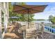 Outdoor dining set and umbrella on the deck with views of the lake at 592 Shoreline Rd, New London, NC 28127
