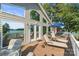 Relaxing deck with lounge chairs, an umbrella, and stunning lake views, ideal for outdoor enjoyment at 592 Shoreline Rd, New London, NC 28127