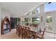 Bright dining area with lake views and large windows, ideal for entertaining or everyday meals at 592 Shoreline Rd, New London, NC 28127
