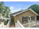 Charming exterior elevation of home with wooden steps to the front door and lakeside views at 592 Shoreline Rd, New London, NC 28127