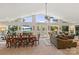 Open-concept living and dining area with lake views through large windows, creating a bright atmosphere at 592 Shoreline Rd, New London, NC 28127