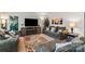 Cozy living room featuring comfortable seating, a fireplace, and a large TV for relaxation at 592 Shoreline Rd, New London, NC 28127