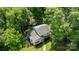 Aerial perspective of a home nestled among vibrant green trees, providing a sense of privacy at 6713 William Harry Ct, Charlotte, NC 28211