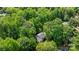 Beautiful aerial view of home surrounded by dense, mature trees for ultimate privacy at 6713 William Harry Ct, Charlotte, NC 28211