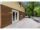 Spacious back deck with white railings and brick wall, perfect for outdoor entertaining at 6713 William Harry Ct, Charlotte, NC 28211