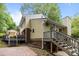 Backyard with stairs, wooden patio and brick pathway at 6713 William Harry Ct, Charlotte, NC 28211
