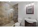 Beautiful bathroom featuring tiled shower, toilet, and sleek vanity at 6713 William Harry Ct, Charlotte, NC 28211