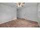 Spacious bedroom features hardwood floors, ceiling fan, two doors and natural lighting at 6713 William Harry Ct, Charlotte, NC 28211