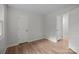 Bright bedroom features hardwood floors, neutral paint, and two door frames at 6713 William Harry Ct, Charlotte, NC 28211
