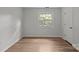 Simple bedroom with wood floor, neutral walls, and lots of light at 6713 William Harry Ct, Charlotte, NC 28211