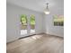 Dining room has french doors to patio, wood floor, and lots of natural light at 6713 William Harry Ct, Charlotte, NC 28211