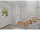Bright entryway with tile floors and wooden stairs at 6713 William Harry Ct, Charlotte, NC 28211