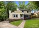Captivating street view of a two-story home with a well-maintained lawn and traditional facade at 6713 William Harry Ct, Charlotte, NC 28211