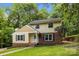 Charming two-story home with a well-manicured front lawn and classic architectural details at 6713 William Harry Ct, Charlotte, NC 28211