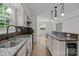 Bright kitchen with an island, stainless steel appliances, and modern lighting fixtures at 6713 William Harry Ct, Charlotte, NC 28211