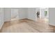 Open-concept room with wood floors, staircase, and a view of the kitchen at 6713 William Harry Ct, Charlotte, NC 28211