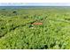 An aerial view pinpointing the property in a vast expanse of lush, dense forest at 679 Fairforest Rd, Chester, SC 29706