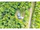 An aerial view of the home nestled within a dense forest setting at 679 Fairforest Rd, Chester, SC 29706