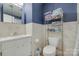 Traditional bathroom featuring white tile, a standard toilet and towel rack at 679 Fairforest Rd, Chester, SC 29706