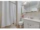 Neutral bathroom featuring a shower curtain, a standard toilet, and white vanity at 679 Fairforest Rd, Chester, SC 29706