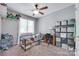 Neutral-toned bedroom with a ceiling fan, natural light, and ample space for storage and personalization at 679 Fairforest Rd, Chester, SC 29706