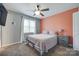 Cozy bedroom featuring a colorful accent wall, plush carpeting, and ample natural light for relaxation at 679 Fairforest Rd, Chester, SC 29706