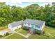 Beautiful two-story home with a detached garage, mature landscaping, and a welcoming entrance at 679 Fairforest Rd, Chester, SC 29706