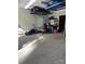 Well-lit garage with shelving, offering functional storage space for tools and equipment at 679 Fairforest Rd, Chester, SC 29706