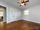 Bright bedroom featuring hardwood floors, closet and natural light at 6922 Woodstock Dr, Charlotte, NC 28210
