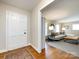 Inviting view into a living room with hardwood floors and a cozy couch, showcasing the home's layout at 6922 Woodstock Dr, Charlotte, NC 28210