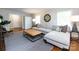 Bright living room featuring a comfortable sectional sofa, a leather ottoman, and stylish decor at 6922 Woodstock Dr, Charlotte, NC 28210