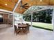 Covered patio with a wooden ceiling, ceiling fan, and backyard views at 6922 Woodstock Dr, Charlotte, NC 28210