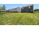 Exterior view of the home’s backyard with green grass and modern fences at 699 Kitfox Nw Dr, Concord, NC 28027