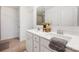 Double vanity bathroom with white cabinets, quartz countertops, and tiled flooring at 699 Kitfox Nw Dr, Concord, NC 28027