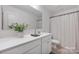 Bright bathroom featuring a quartz countertop, a modern sink, and elegant fixtures at 699 Kitfox Nw Dr, Concord, NC 28027