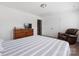 Bedroom with a wooden dresser, TV, and plush armchair, offering a cozy retreat space at 699 Kitfox Nw Dr, Concord, NC 28027