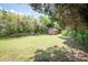 Backyard showcasing a shed surrounded by grass and trees at 734 Club Dr, Statesville, NC 28677