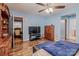 Spacious bedroom with hardwood floors, closet, and a ceiling fan at 734 Club Dr, Statesville, NC 28677