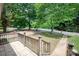 Inviting front porch with tiled flooring and a view of the well-maintained front yard at 734 Club Dr, Statesville, NC 28677