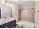 Modern bathroom with updated vanity, shower/tub combination and contemporary fixtures at 8221 Pineville Matthews Rd # G, Charlotte, NC 28226