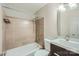 Bathroom features tiled shower over tub and modern vanity sink at 8221 Pineville Matthews Rd # G, Charlotte, NC 28226