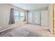 Spacious bedroom with plush carpet, generous closet space and lots of natural light at 8221 Pineville Matthews Rd # G, Charlotte, NC 28226