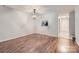 Dining room featuring hard wood floors and modern chandelier at 8221 Pineville Matthews Rd # G, Charlotte, NC 28226