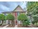 Charming brick townhome with mature landscaping and a welcoming front entrance at 8221 Pineville Matthews Rd # G, Charlotte, NC 28226