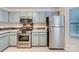 Modern kitchen featuring stainless steel appliances and ample cabinet space at 8221 Pineville Matthews Rd # G, Charlotte, NC 28226